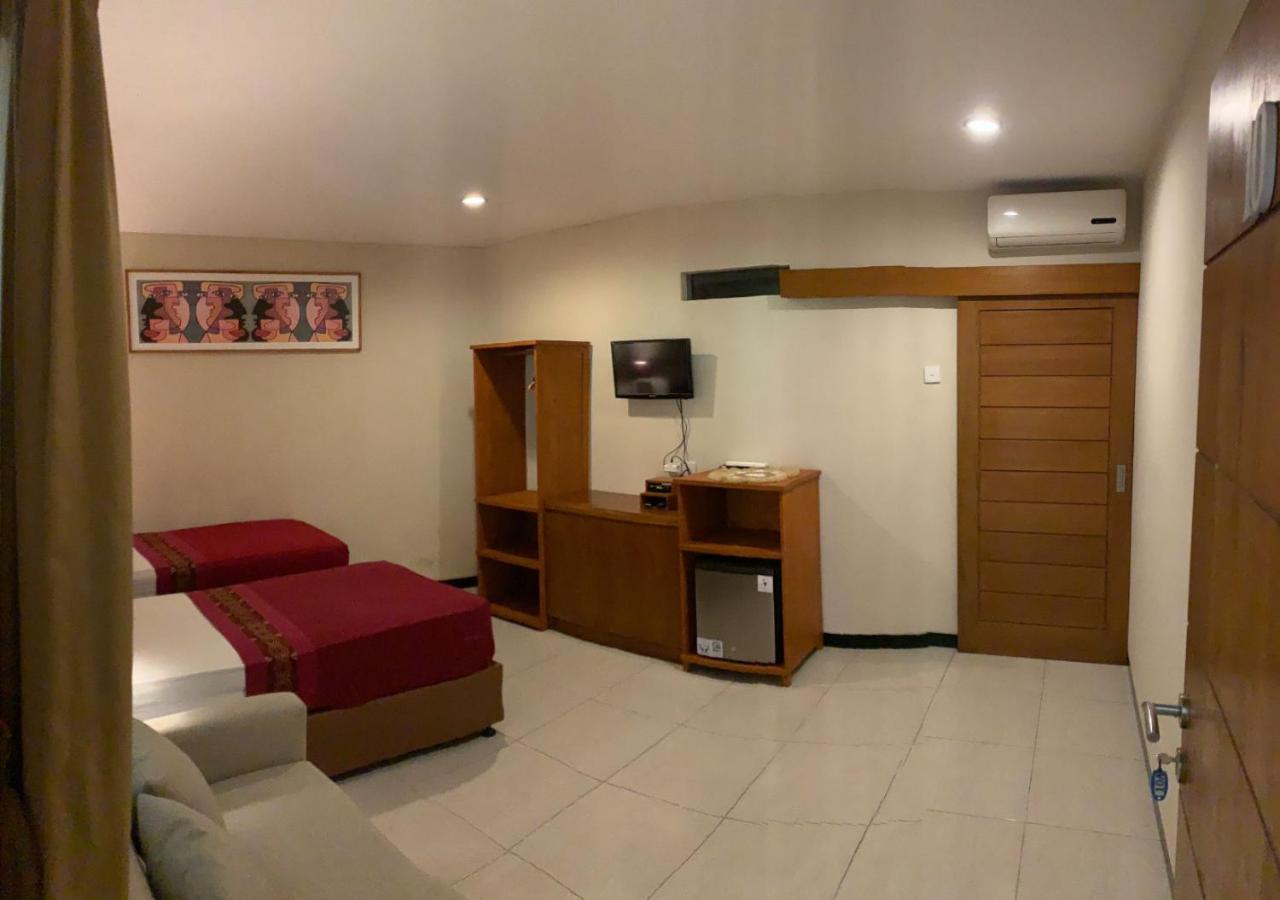 Kuta Suci Guesthouse Luaran gambar