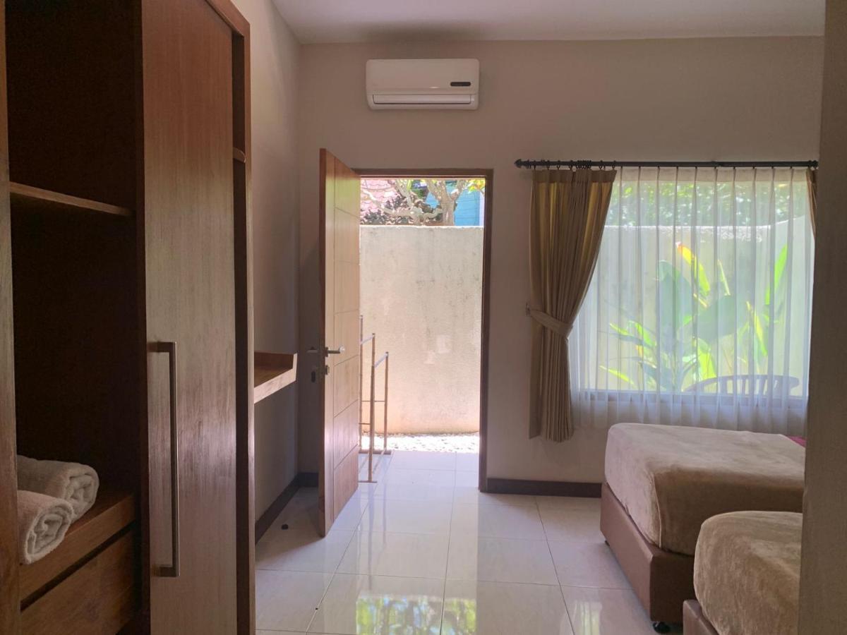 Kuta Suci Guesthouse Luaran gambar